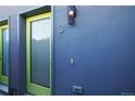 Building entrance with modern lime green door at 3450 N Downing St # 3, Denver, CO 80205