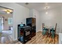 Retro kitchen with black appliances and a small dining table at 2660 Utica St, Denver, CO 80212