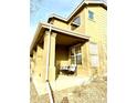 Covered porch with two modern chairs, offering a relaxing outdoor space at 12578 Dexter Way, Thornton, CO 80241