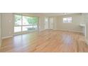 Living room with hardwood floors and access to kitchen at 2866 E Euclid Pl, Centennial, CO 80121