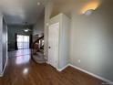 Bright entryway with hardwood floors and stairs at 19093 E Bellewood Dr, Aurora, CO 80015