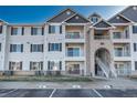 Apartment building exterior with parking and landscaping at 15700 E Jamison Dr # 7205, Englewood, CO 80112