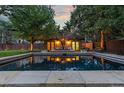 Inviting backyard pool with surrounding patio and seating at 235 Eudora St, Denver, CO 80220
