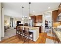 Spacious kitchen featuring an island and stainless steel appliances at 7916 E 149Th Pl, Thornton, CO 80602