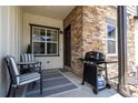 Private patio with seating and grill, perfect for entertaining at 1481 Harebell St, Berthoud, CO 80513
