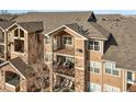 Attractive three-story building with balconies and stone accents at 10805 Twenty Mile Rd # 307, Parker, CO 80134