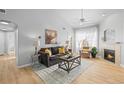 Spacious living room with fireplace and hardwood floors at 10805 Twenty Mile Rd # 307, Parker, CO 80134