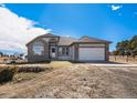 Brick ranch home with attached two-car garage at 34553 Columbine E Trl, Elizabeth, CO 80107