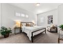 Comfortable bedroom with a queen-size bed and neutral decor at 163 S Harrison St, Denver, CO 80209