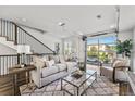 Open living space with glass garage door and modern furniture at 163 S Harrison St, Denver, CO 80209