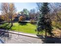 Lovely community green space with mature trees and landscaping at 818 S Terry St # 85, Longmont, CO 80501