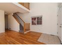 Bright entryway with hardwood floors and staircase at 818 S Terry St # 85, Longmont, CO 80501