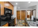Well-equipped kitchen with modern appliances and granite countertops at 34 Highfield Trl # 203, Breckenridge, CO 80424