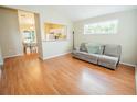 Living room with hardwood floors and view to dining area at 1758 Eagle St # A, Aurora, CO 80011