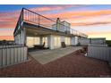 Spacious rooftop deck with city views, planters, and patio furniture at 1313 Steele St # 801, Denver, CO 80206