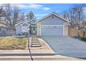 Charming single-Gathering home with gray siding, attached garage, and inviting front yard at 1012 E 130Th Pl, Thornton, CO 80241