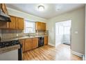 Bright kitchen with wood cabinets and a view to the dining area at 4481 Wolff St, Denver, CO 80212