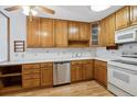 Kitchen features wood cabinets, stainless steel dishwasher, and light countertops at 660 S Alton Way # 5C, Denver, CO 80247