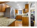 Kitchen features granite countertops and stainless steel appliances at 5109 S Emporia Way, Greenwood Village, CO 80111