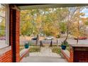 Inviting front porch with brick detailing, offering a charming entryway to the home at 345 S Ogden St, Denver, CO 80209