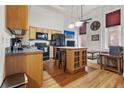 Modern kitchen with wood cabinets and island at 1555 California St # 316, Denver, CO 80202