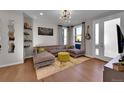 Living room with L-shaped sofa and access to patio at 3548 Corsica Way, Castle Rock, CO 80109