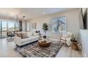 Open concept living room and dining area with modern decor at 711 N Waterloo Ct, Aurora, CO 80018