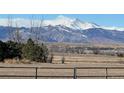 Open space with mountain views in the background at 385 Baxter Farm Ln, Erie, CO 80516