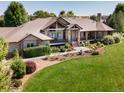 Ranch-style home on a spacious lot with mature landscaping and a large yard at 385 Baxter Farm Ln, Erie, CO 80516