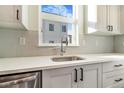 Modern kitchen sink and countertops with white cabinets at 5870 W 91St Ave, Westminster, CO 80031