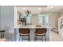 Modern kitchen featuring a breakfast bar and stainless steel appliances at 1649 S Ivory Cir # D, Aurora, CO 80017
