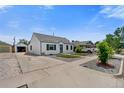 Front view of a single story home with a driveway at 136 S 9Th Ave, Brighton, CO 80601