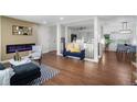 Living room with fireplace, hardwood floors, and stylish furniture at 2996 S Sheridan Blvd, Denver, CO 80227