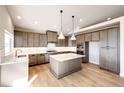 Modern kitchen with an island and stainless steel appliances at 37057 Still Rock Pt, Elizabeth, CO 80107