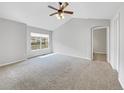 Spacious bedroom with carpeted floors and ceiling fan at 1430 Whitehall Dr # 9C, Longmont, CO 80504