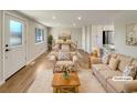 Bright living room features hardwood floors, neutral walls, and ample natural light at 1059 S Saulsbury St, Lakewood, CO 80226