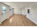 Spacious living area featuring hardwood floors and lots of natural light at 1059 S Saulsbury St, Lakewood, CO 80226