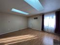 Bright living room featuring hardwood floors and large windows at 15503 E Princeton Ave, Aurora, CO 80013