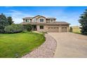 Two-story house with a landscaped yard and driveway at 5861 E Valley Hi Dr, Parker, CO 80138