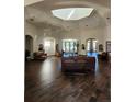 Lobby with a high ceiling, comfortable seating, and wood-like flooring at 2855 Rock Creek Cir # 158, Superior, CO 80027