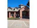 Exterior of a brick building with a large entryway and accessible ramp at 2855 Rock Creek Cir # 158, Superior, CO 80027