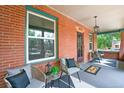 Inviting front porch with brick facade and seating at 1843 Spruce St, Boulder, CO 80302