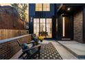 Cozy patio with two chairs, a table, and a rug at 3362 W 32Nd Ave, Denver, CO 80211