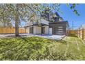 Contemporary home with fenced backyard and attached garage at 3212 S Dahlia St, Denver, CO 80222