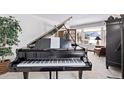 A Kawai grand piano sits in a sunlit living room at 1324 Shadow Mountain Dr, Highlands Ranch, CO 80126