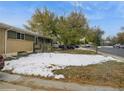 House exterior with front yard and snow at 300 S Simms St, Lakewood, CO 80228