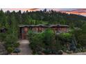 Luxury home exterior at dusk, showcasing landscaping and mountain views at 1420 Sierra Dr, Boulder, CO 80302