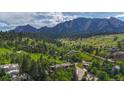 Aerial view of a neighborhood nestled in the mountains at 1420 Sierra Dr, Boulder, CO 80302