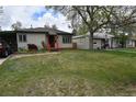 Two homes side by side, with green lawns in front at 1881 S Saint Paul St, Denver, CO 80210