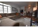 Spacious living room with L-shaped sofa and hardwood floors at 1881 S Saint Paul St, Denver, CO 80210